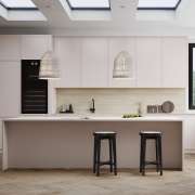 Creamy cabinetry bathed in natural lighting​